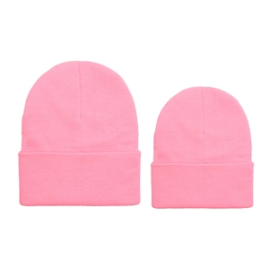 Close-up of pink parent-child knitted beanies set with soft ribbed texture for winter