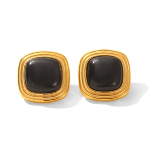 Detailed view of vintage gold stud earrings featuring polished square black tiger eye stones