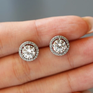 Elegant S925 silver halo stud earrings with a large round moissanite on fingertips