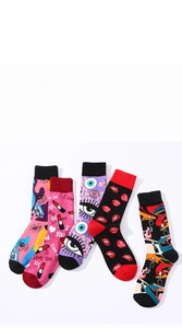 Detail of five cotton mid-calf socks with vibrant red lips and eye pop art patterns