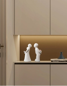 Close-up of white matte ceramic couple statues with abstract modern minimalist texture