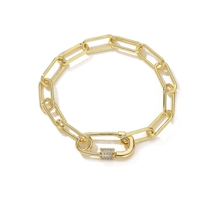 Gold-plated paperclip chain bracelet with a micro-paved crystal lock clasp on white background