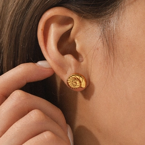 18K gold-plated stainless steel conch stud earrings worn on model for a luxury look