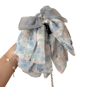 Pince à cheveux avec nœud en mousseline florale perles blanches et longs glands