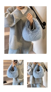 Detail view of a light blue fluffy faux fur handbag with a soft, shaggy texture and plush feel