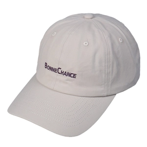 Classic cream cotton baseball cap with Bonne Chance embroidery and curved brim