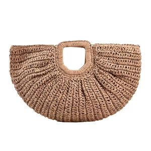 Handwoven straw tote bag with semi-circular design and sturdy top handle for summer holidays