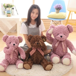 Plush teddy bear toy in pink purple and dark brown with rose-textured faux fur and ribbon bow