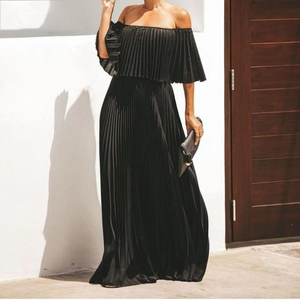 Close-up of the pleated texture and flowy chiffon fabric of this black off-shoulder dress