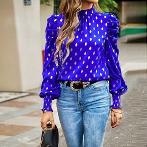 Women's blue and gold polka dot blouse with puff sleeves and elegant high neck