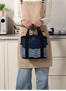 Detail of blue wave pattern lunch bag with mesh side pocket and sturdy handles