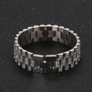 Macro detail of silver hip hop tank bracelet with three rows of cubic zirconia stones