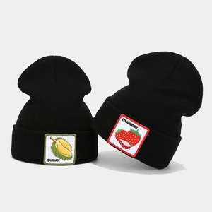 Knitted winter beanie hats with durian and strawberry patches in black color