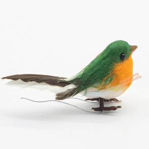Detail of handcrafted robin bird decor with realistic feathers and green fiber body