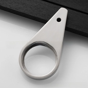 Detail of tear-drop shaped stainless steel bottle opener with matte brushed metal finish