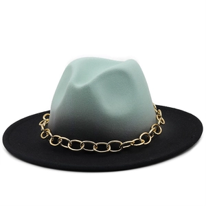 Detail of mint green gradient fedora hat with a bold gold metal chain band