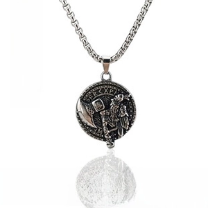 Macro view of vintage Viking relief pendant with Thor hammer and box chain details