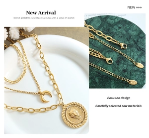 Detailed view of layered gold necklace showing K18 stamp and lion head relief pendant