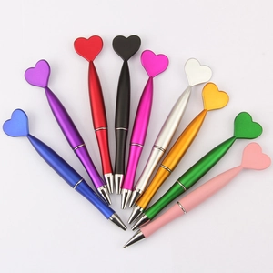 Set of nine heart top ballpoint pens in vibrant metallic colors for gift giving