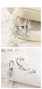 Detail of silver hoop earrings with a large round zircon and pavé star pendant