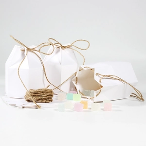 European white kraft paper hexagonal candy box with jute rope bow and jelly beans display