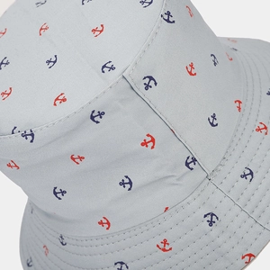 Light gray cotton bucket hat featuring reversible nautical anchor prints for sun protection