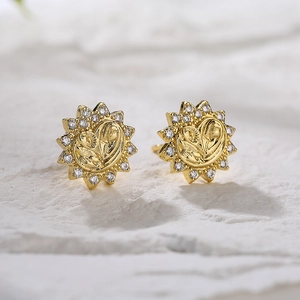 Pair of 18K gold plated celestial stud earrings featuring zircon micro-inlay and sunburst design