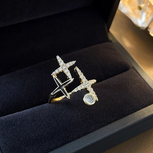 Detailed close-up of gold-plated star ring with pavé zircons in a blue velvet box