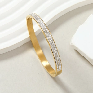 Elegant gold titanium steel bangle with three rows of sparkling crystal stones