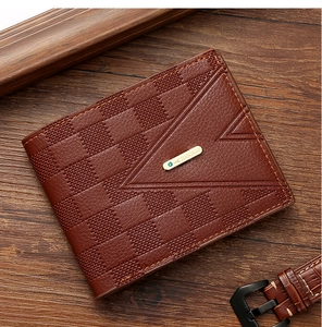 Macro detail of brown leather checkerboard pattern and V-stitching on men's wallet