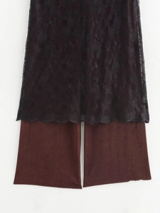 Flat lay of black lace top and brown wide-leg striped pants set on white background