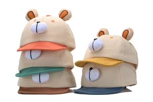 Detailed pile of cotton baby baseball caps with cute bear ears in multiple colors