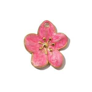 Close-up of pink flower petal charm with gold details and delicate enamel texture