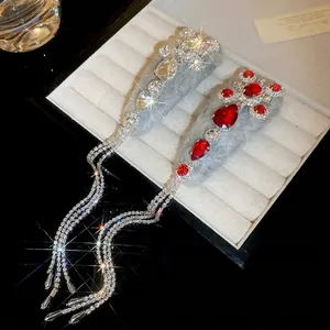Luxurious grey velvet hair clips with red crystals and long rhinestone tassels in a gift box