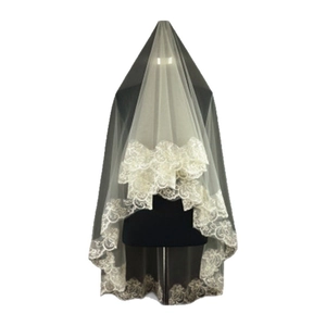 Three-meter white bridal veil with elegant floral lace embroidery on a mannequin