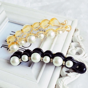 Elegant pearl banana hair clips in amber and black finish with rhinestone accents