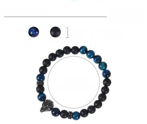 Detail of 8mm blue tiger eye and matte stone bracelet with wolf head and size specs