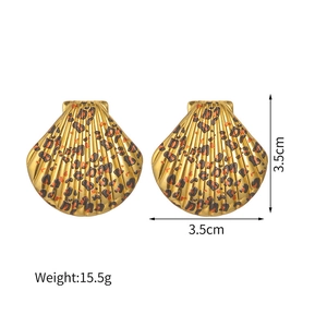 Detail shot showing 3.5cm leopard print shell earrings with dimensions and weight info