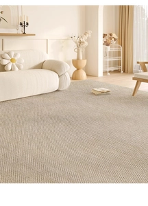Detail of cream-colored woven rug texture in a modern minimalist living room setting