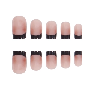 Glossy French manicure press-on nails with natural pink base and black curved tips