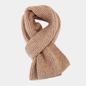 Close-up of thick winter knit scarf with two-tone grey and caramel striped texture
