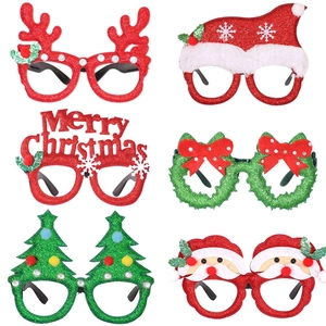 Close-up of festive Christmas glasses featuring reindeer horns and Santa designs