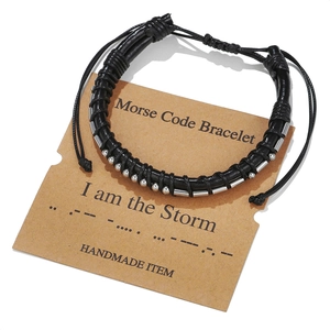 Handmade leather Morse code bracelet with metal beads featuring I am the Storm message