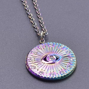 Macro shot of rainbow stainless steel evil eye necklace with sparkling clear rhinestones