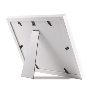 White baby paw print frame back view with easel stand and secure swivel tabs
