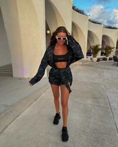 Chic three-piece lounge set with printed cardigan, high-waisted shorts and sports bra