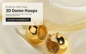 Detailed macro of 18K gold plated spherical earrings on soft silk fabric background