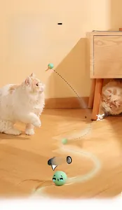 Macro view of interactive green cat toy ball with feather tail for indoor play