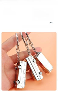 Detail view of bus-shaped metal keychain with high-gloss mirror polished silver finish