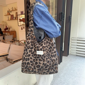 Detail of plush leopard print tote bag showing the soft texture and large capacity